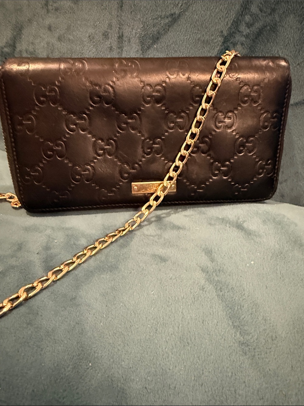 Gucci Black Embossed GG Zip Clutch/Wallet with Gold Plaque